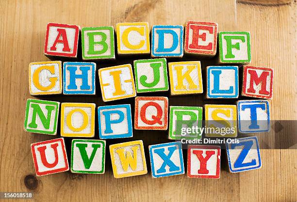 vintage wooden letters blocks, alphebetical order - fairytale alphabet stock pictures, royalty-free photos & images