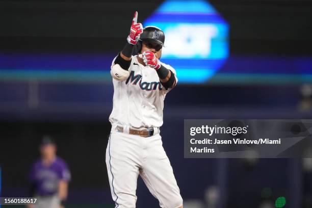 Luis Arraez of the Miami Marlins reacts towards the dugout after hitting a double Colorado Rockies at loanDepot park on July 23, 2023 in Miami,...