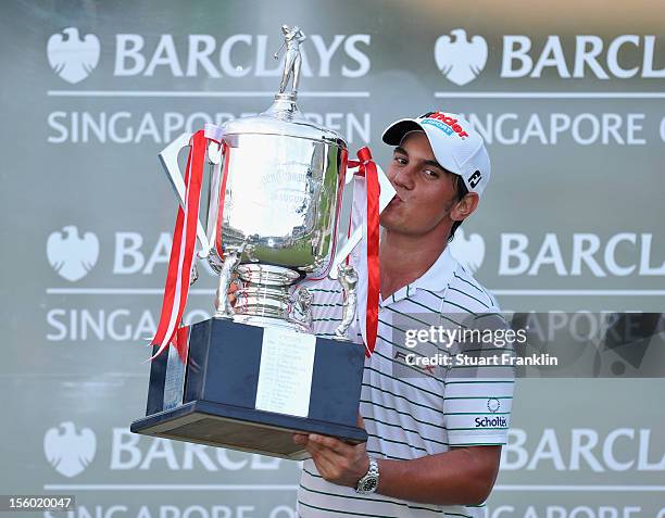 Matteo Manassero of Italy with the winners trophy after winning in a three hole playoff with Louis Oosthuizen of South Africa during the final round...