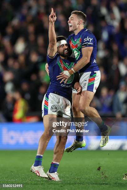 Shaun Johnson of the Warriors celebrates his drop goal with Luke Metcalf in golden point extra time to win the match during the round 21 NRL match...