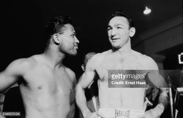 American boxers Sugar Ray Robinson and Carmen Basilio at their World Middleweight title rematch at Chicago Stadium, 25th March 1958. Robinson won the...