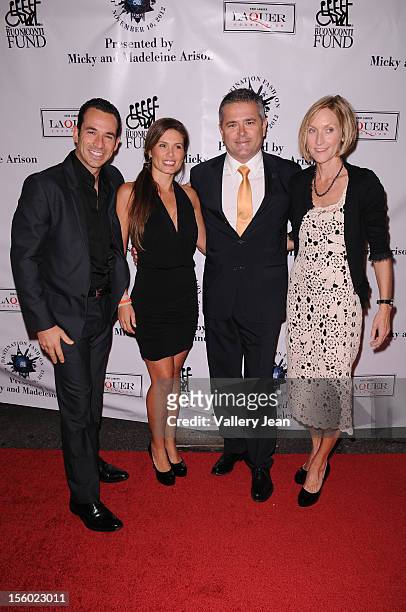 Helio Castroneves, Adriana Henao and Gil De Ferran attend Buoniconti Fund to Cure Paralysis' Destination Fashion 2012 at Bal Harbour Shops on...