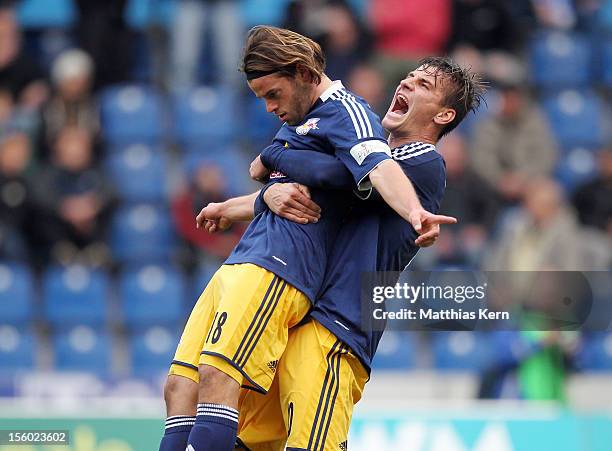 Timo Roettger of Leipzig jubilates with team mate Stefan Kutschke after scoring the fifth goal during the Regionalliga Nordost match between 1.FC...