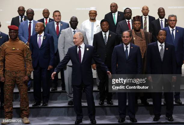 Russian President Vladimir Putin waves during a group photo at the Second Summit Economic And Humanitarian Forum Russia Africa, on July 28 in Saint...