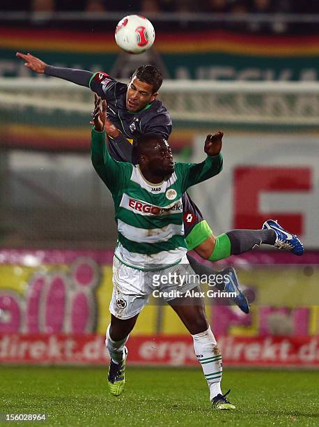 Gerald Asamoah of Greuther Fuerth is challenged by Alvaro Dominguez Soto during the Bundesliga match between SpVgg Greuther Fuerth and Borussia...