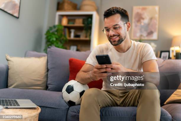 sports betting and the joy of winning - home game sport stock pictures, royalty-free photos & images