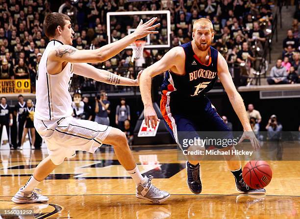Joe Willman of the Bucknell Bison dribbles the ball against Sandi Marcius of the Purdue Boilermakers at Mackey Arena on November 9, 2012 in West...
