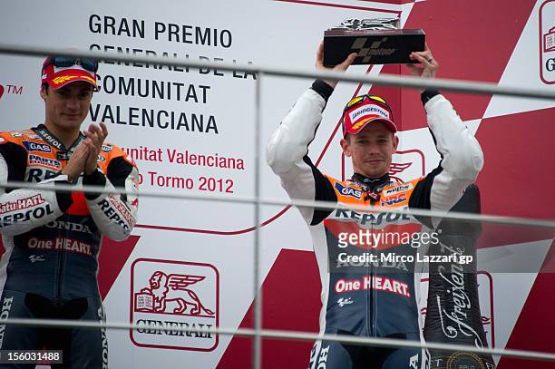 Casey Stoner of Australia and Repsol Honda Team and Dani Pedrosa of Spain and Repsol Honda Team celebrate on the podium at the end of the MotoGP race...
