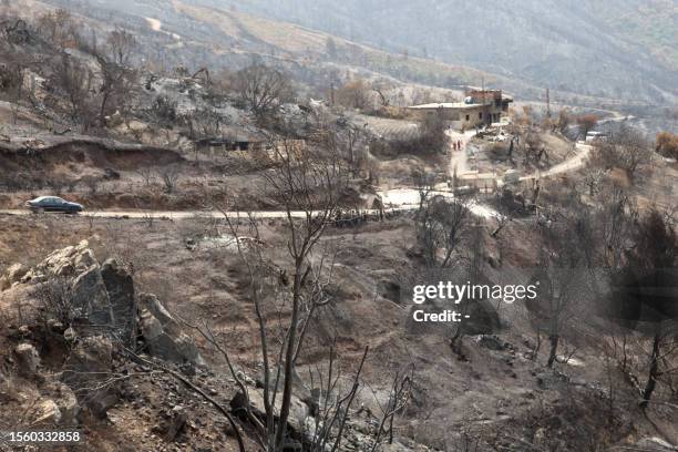 General view shows the aftermath of a forest fire in Bejaia, 250 kilometres from Algiers, on July 28, 2023. Algerians in the fire-ravaged northeast...