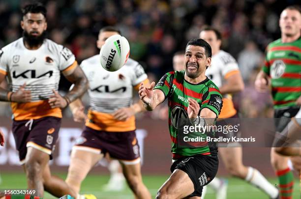 Cody Walker of the Rabbitohs passes the ball during the round 21 NRL match between South Sydney Rabbitohs and Brisbane Broncos at Sunshine Coast...