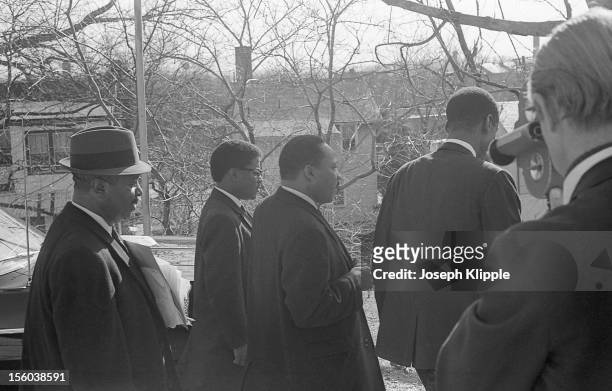 American Civil Rights leader Dr. Martin Luther King Jr and others are filmed outside the New York Avenue Presbyterian Church, Washington DC, February...