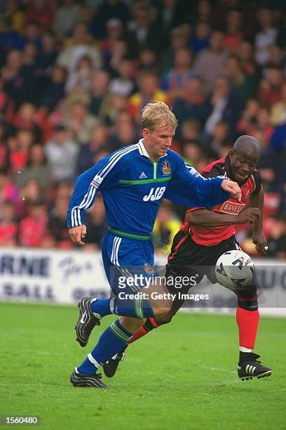 Kevin Sharpe of Wigan tussles with Paul Hall of Walsall during the Nationwide League Division Two match at the Bescot Stadium, in Walsall, England....