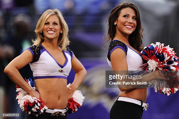 Baltimore Ravens cheerleaders look in to the crowd during an NFL game against the Oakland Raiders at M&T Bank Stadium on November 11, 2012 in...