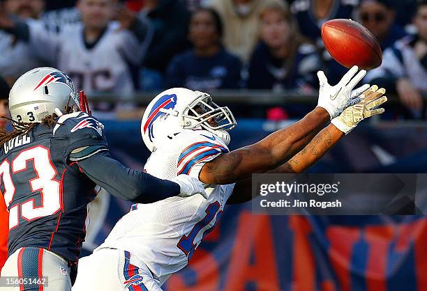 Donald Jones of the Buffalo Bills comes up short on a pass as Marquice Cole of the New England Patriots defends in the second half at Gillette...