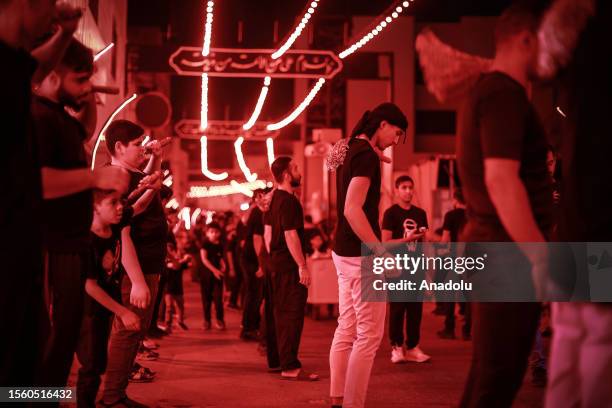 Hundreds of people take part in a mourning ritual, during the month of Muharram on the Islamic calendar, leading up to the day of Ashura, on July 28,...