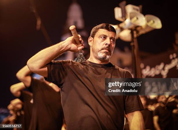 Hundreds of people take part in a mourning ritual, during the month of Muharram on the Islamic calendar, leading up to the day of Ashura, on July 28,...