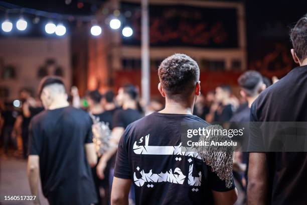 Hundreds of people take part in a mourning ritual, during the month of Muharram on the Islamic calendar, leading up to the day of Ashura, on July 28,...