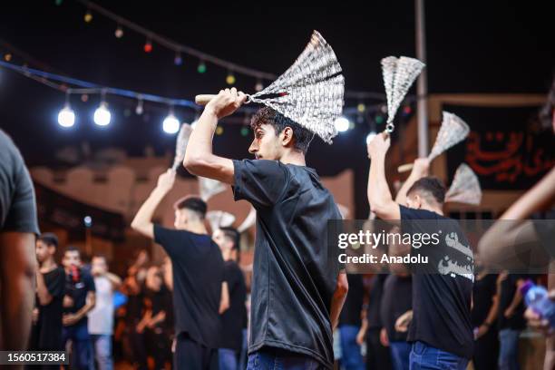 Hundreds of people take part in a mourning ritual, during the month of Muharram on the Islamic calendar, leading up to the day of Ashura, on July 28,...