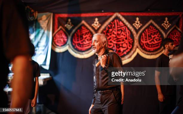 Hundreds of people take part in a mourning ritual, during the month of Muharram on the Islamic calendar, leading up to the day of Ashura, on July 28,...