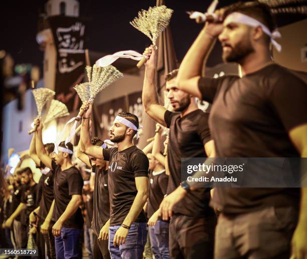 Hundreds of people take part in a mourning ritual, during the month of Muharram on the Islamic calendar, leading up to the day of Ashura, on July 28,...