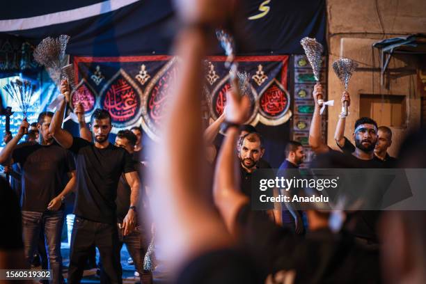 Hundreds of people take part in a mourning ritual, during the month of Muharram on the Islamic calendar, leading up to the day of Ashura, on July 28,...