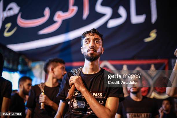 Hundreds of people take part in a mourning ritual, during the month of Muharram on the Islamic calendar, leading up to the day of Ashura, on July 28,...