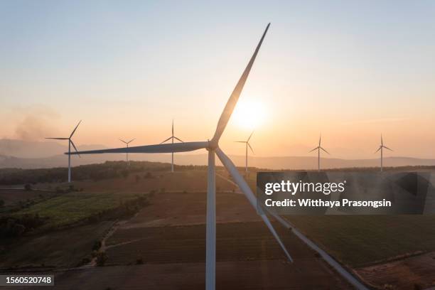 aerial view of wind turbines and agriculture field - climate change stock pictures, royalty-free photos & images