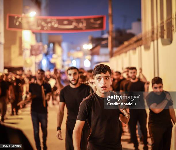 Hundreds of people take part in a mourning ritual, during the month of Muharram on the Islamic calendar, leading up to the day of Ashura, on July 28,...