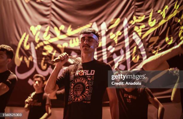 Hundreds of people take part in a mourning ritual, during the month of Muharram on the Islamic calendar, leading up to the day of Ashura, on July 28,...