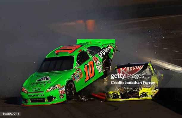 Danica Patrick, driver of the GoDaddy.com Chevrolet, and Paul Menard, driver of the Menards/Rheem Chevrolet, collide on track after an incident in...