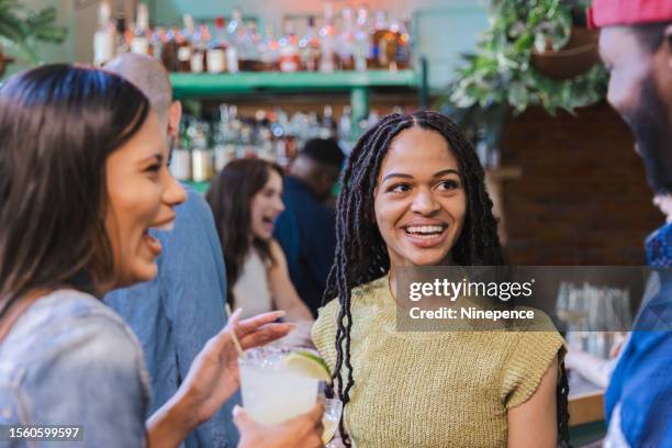 friends drinking cocktails at a bar - bloody mary stock pictures, royalty-free photos & images