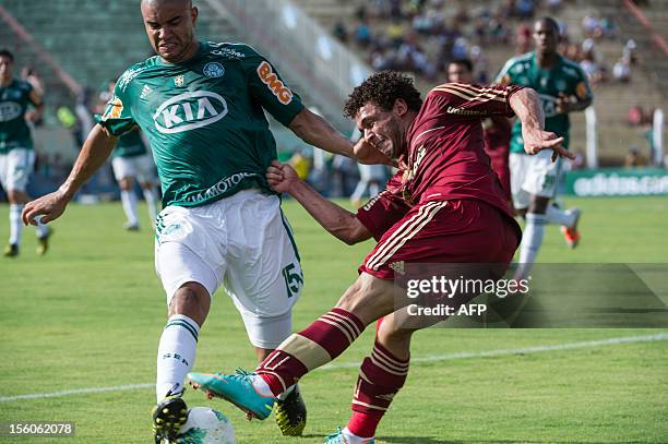 Footballer Mauricio Ramos of Palmeiras blocks the shot of Wellington Nem of Fluminense during a Brazilian tournament match, at Prudentao stadium in...