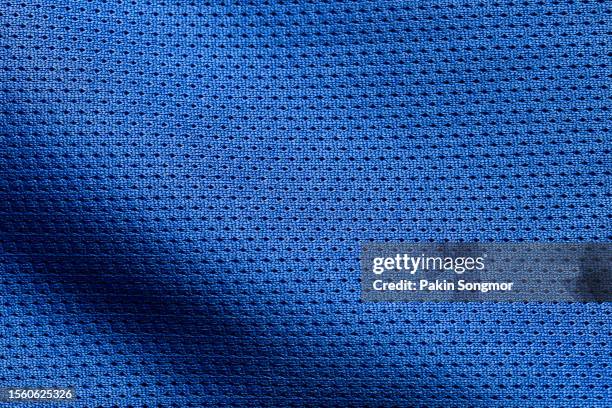 blue color sports clothing fabric football shirt jersey texture and textile background. - jersey stock-fotos und bilder