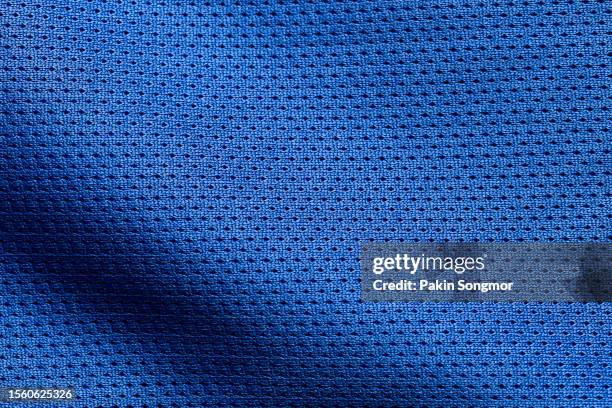 blue color sports clothing fabric football shirt jersey texture and textile background. - polyester stock pictures, royalty-free photos & images