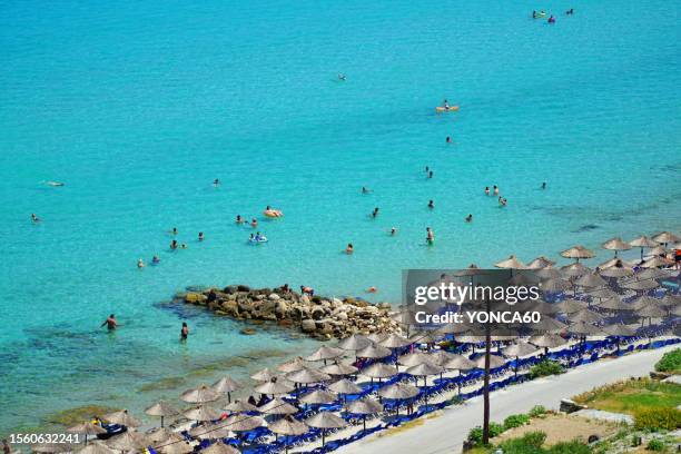 athitos beach, greece - sonnenliege stock-fotos und bilder
