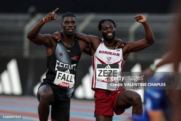 France's Mouhamadou Fall and Ryan Zeze react after winning first and second place respectively in a men 100m serie event during the 2023 French...