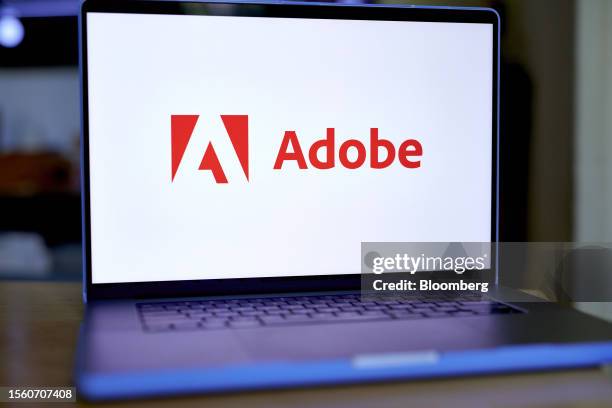 The Adobe logo on a laptop arranged in the Brooklyn borough of New York, US, on Friday, July 28, 2023. Adobe Inc.s $20 billion takeover of design...