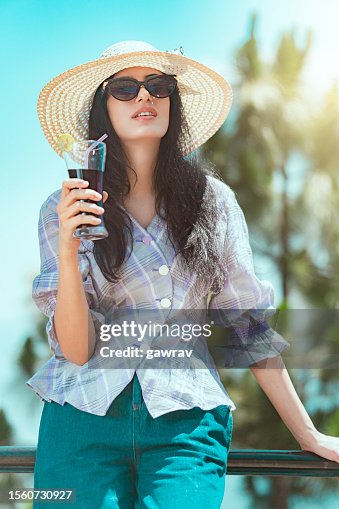 Beautiful young woman enjoys her summer holiday in the hills.