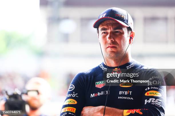 Sergio Perez of Mexico and Oracle Red Bull Racing looks on in the garage during practice ahead of the F1 Grand Prix of Hungary at Hungaroring on July...