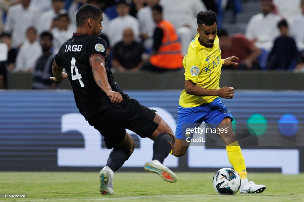 Ghareeb Nassr's Saudi midfielder Abdulrahman Ghareeb is marked by Shabab's ...
