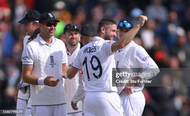 England bowler Chris Woakes celebrates after taking the wicket of David Warner during day two of the LV= Insurance Ashes 4th Test Match between...