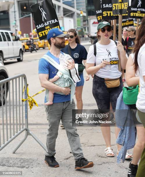 Daniel Radcliffe and Erin Darke join the picket line In New York City on July 21, 2023 in New York City. Members of SAG-AFTRA, Hollywood's largest...