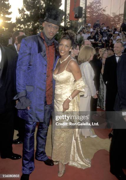 Athlete Dennis Rodman and Actress Vivica A. Fox attend the 69th Annual Academy Awards on March 24, 1997 at Shrine Auditorium in Los Angeles,...