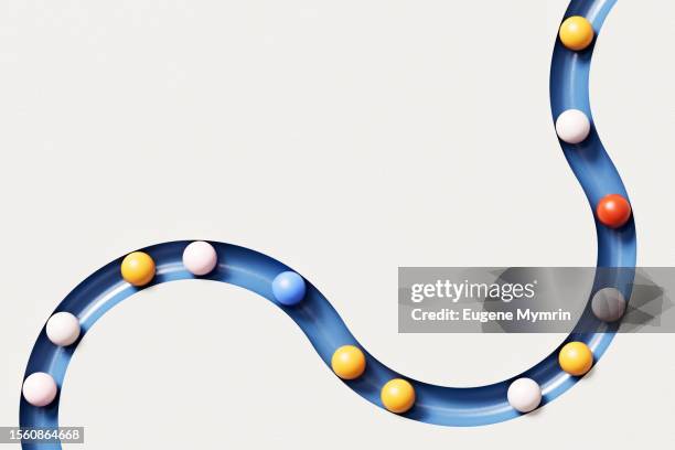 3d image of rolling spheres along a path. - zigzag path stock pictures, royalty-free photos & images