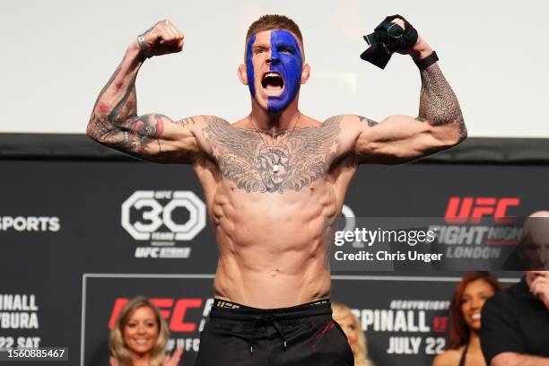 Chris Duncan of Scotland poses on the scale during the UFC Fight Night ceremonial weigh-in at The O2 Arena on July 21, 2023 in London, England.