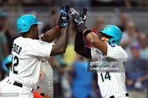 Bryan De La Cruz of the Miami Marlins celebrates his home run with teammate Jorge Soler during the first inning of the game between the Detroit...