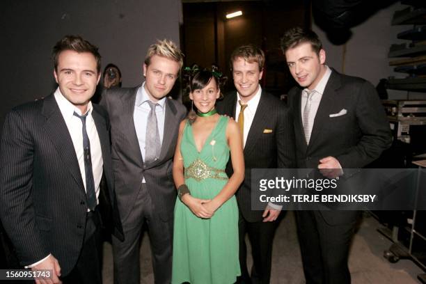 The boyband "Westlife" poses backstage with the United Kingdom entry Cory Spedding at the 2004 Junior Eurovision Song Contest in the 1994 Winter...
