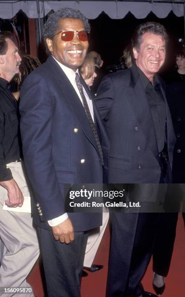 Actor Clarence Williams III and Actor Michael Cole attend the 'Sugar Hill' Hollywood Premiere on Mann's Chinese Theatre in Hollywood, California.