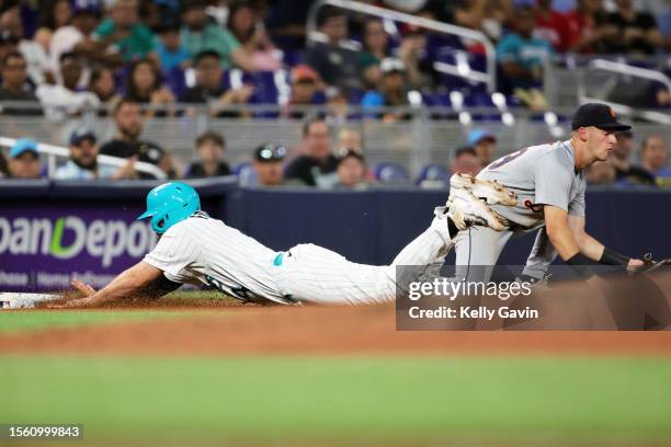 Nick Fortes of the Miami Marlins slides into third base during the fourth inning of the game between the Detroit Tigers and the Miami Marlins at...