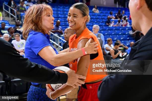 Natasha Cloud of the Washington Mystics talks with Nancy Lieberman before the game against the Dallas Wings on July 28, 2023 at the College Park...